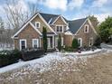 Brick home with snow covered lawn at 7801 Windswept Way, Douglasville, GA 30135