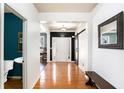 Hardwood floors, half bath, and barn door entry at 928 Buckhorn Bnd, Locust Grove, GA 30248
