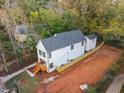 New construction home with fenced backyard and a wooded backdrop at 2438 2Nd Nw St, Atlanta, GA 30318