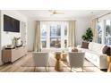 Living Room with white couch and large windows, and hardwood floors at 1870 Vigo Ne St, Atlanta, GA 30307