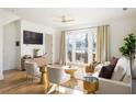 Living room with white couch and large windows, hardwood floors at 1870 Vigo Ne St, Atlanta, GA 30307