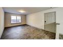 Empty living room with wood-look floors and neutral walls at 3102 Fairington Village Dr, Lithonia, GA 30038