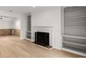 Living room with hardwood floors, fireplace and built-in shelving at 2042 Brian Way, Decatur, GA 30033