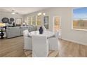 Charming dining area with round table and four white chairs at 2210 Cormac St, East Point, GA 30344