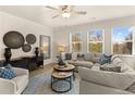 Bright living room featuring a comfortable sectional sofa and large windows at 2210 Cormac St, East Point, GA 30344