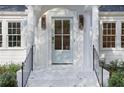 Light blue front door with white columns and porch at 641 Longwood Nw Dr, Atlanta, GA 30305