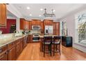 Well-lit kitchen with stainless steel appliances, granite countertops, and an island with bar stools at 2827 Overlook Ne Trce, Atlanta, GA 30324