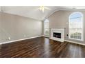 Living room features hardwood floors and a fireplace at 341 Harris Ave, Locust Grove, GA 30248