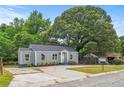 Newly renovated gray house with a landscaped yard at 819 Norwood Se Rd, Atlanta, GA 30315