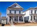 Charming two-story home with a welcoming front porch and professionally landscaped front yard at 120 Stonehouse Dr, Cumming, GA 30040