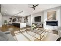 Open concept living space featuring a kitchen island and fireplace at 902 Lenox Ne Blvd, Atlanta, GA 30324