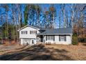 Two-story house with gray roof and white siding, showcasing a large backyard at 600 Green Mountain Trl, College Park, GA 30349