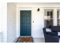 Dark green front door with a stylish welcome mat at 1797 Hosea L Williams Se Dr, Atlanta, GA 30317