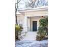 Welcoming front entrance with a dark green door and snowy steps at 1797 Hosea L Williams Se Dr, Atlanta, GA 30317