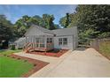 Newly renovated home with front porch and landscaping at 1841 Bayberry Dr, Atlanta, GA 30311