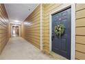 Building hallway with tan walls and a dark blue door at 5641 Roswell Rd # 103, Atlanta, GA 30342