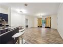 Open living room with hardwood floors and access to kitchen at 5641 Roswell Rd # 103, Atlanta, GA 30342