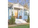 Inviting front porch with wooden door and comfortable seating at 1618 Athens Sw Ave, Atlanta, GA 30310