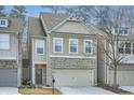 Beautiful townhome exhibiting a neutral color scheme, and a charming front entrance at 1766 Orange Grove Pl, Austell, GA 30106