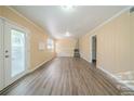 Bright living room featuring wood-look floors and access to the outdoors at 2725 Rainbow Forest Dr, Decatur, GA 30034