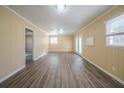 Spacious living room with wood-look floors and neutral walls at 2725 Rainbow Forest Dr, Decatur, GA 30034