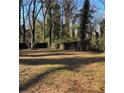 Large backyard with mature trees at 678 Charlotte Nw Pl, Atlanta, GA 30318