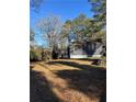 House backyard with trees and grass at 678 Charlotte Nw Pl, Atlanta, GA 30318