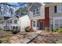 Two story townhome with walkway and landscaping at 6093 Camden Forrest Ct, Riverdale, GA 30296
