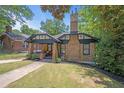 Charming craftsman style home with brick exterior and lush landscaping at 930 White St, Atlanta, GA 30310