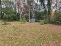 Large backyard with a shed and plenty of trees at 2842 Delowe Dr, Atlanta, GA 30344