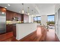 Open concept kitchen with hardwood floors, island, and city views at 270 17Th Nw St # 809, Atlanta, GA 30363