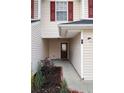 Red front door entry with sidelights and landscaping at 6977 Gallant Se Cir # 8, Mableton, GA 30126