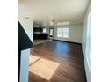 Spacious living room with hardwood floors and access to the kitchen at 1188 To Lani Path, Stone Mountain, GA 30083