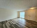 Bright living room featuring vinyl flooring and a view of the patio at 2884 Norfair Loop, Lithonia, GA 30038
