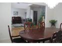 Dining room with hardwood floors and a large table at 665 Roxford Ln, Buford, GA 30518