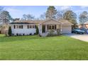 Charming ranch home with a spacious lawn at 1207 Eastview Ne Rd, Conyers, GA 30012