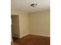 This living room has gleaming hardwood floors and a neutral color palette at 345 Lexington Dr, Lawrenceville, GA 30046