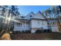 Rear exterior view shows a well-maintained home with an expansive deck perfect for outdoor gatherings at 10 Moss Landing Se Rd, Acworth, GA 30102