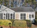 Gray house with stone accents and manicured bushes at 373 Oak Harbor Trl, Marietta, GA 30066