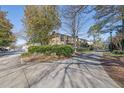 Exterior of building complex with driveway and landscaping at 5400 Roswell Rd # P2, Atlanta, GA 30342