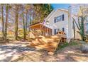 Two-story house with a large deck and screened porch at 2605 Poplar Ln, Cumming, GA 30041