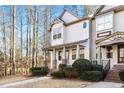 Two-story townhome with brick accents and a charming front porch at 615 Royal Crescent Aly, Canton, GA 30115