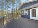 Spacious deck overlooks wooded backyard at 8791 Daerwater Dr, Winston, GA 30187