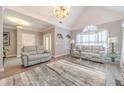 Spacious living room with hardwood floors and large windows at 2040 Hickory Station Cir, Snellville, GA 30078