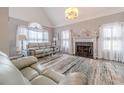 Living room features a fireplace and vaulted ceilings at 2040 Hickory Station Cir, Snellville, GA 30078