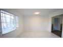 Simple dining room with marble floors and large windows at 2982 Cruse Rd, Lawrenceville, GA 30044