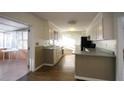 Kitchen features white cabinets and sunlit breakfast area at 2982 Cruse Rd, Lawrenceville, GA 30044