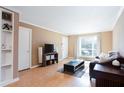 Bright living room with hardwood floors and built-in shelving at 510 Coventry Rd # 19A, Decatur, GA 30030