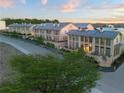Beautiful townhomes with elegant architecture, tile roofs, and lush landscaping at 130 Rolison Way, Fayetteville, GA 30214