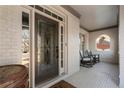 Charming front porch with rocking chairs, white brick, and decorative glass front door at 183 Applewood Ln, Acworth, GA 30101
